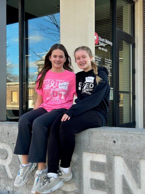 Volunteers sit outside Heart Ministry Center